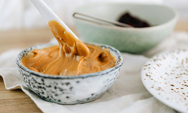 A pot of peanut butter.